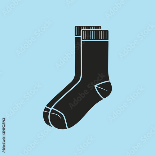 A pair of black socks isolated on a blue background