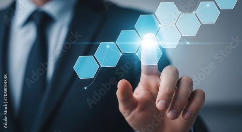 Hand touching glowing hexagonal interface finger