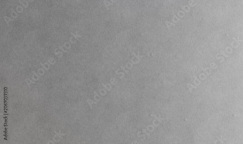 Foto A gray surface filling the entire frame with a white border at the bottom