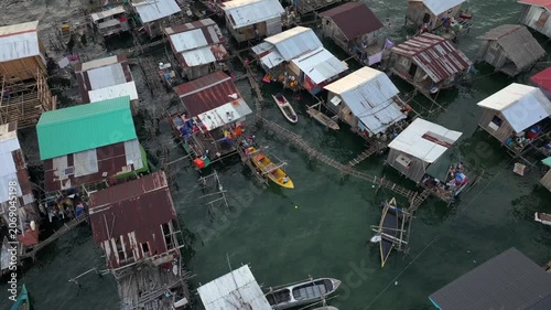 Traditional Bajau Laut Village, Sea Gypsy people in Semporna, Borneo, Malaysia. Stilt Houses Above Sea Waters