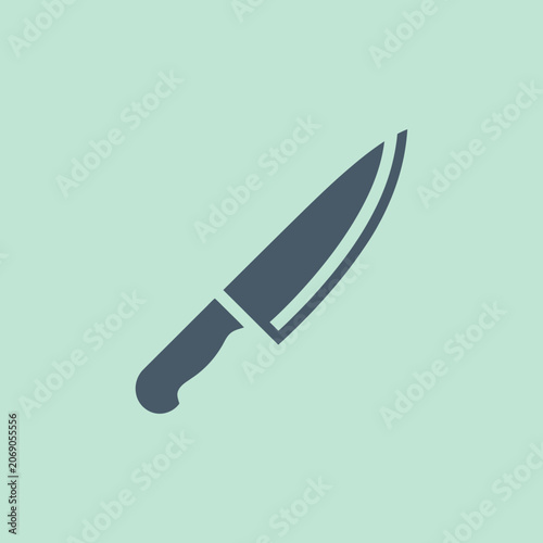 Dark grey chef knife icon isolated on a mint green background