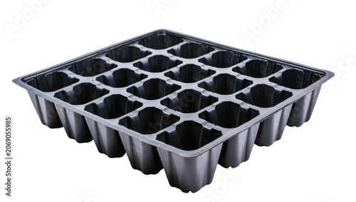 Black plastic seedling tray with 24 individual cells, isolated on transparent background