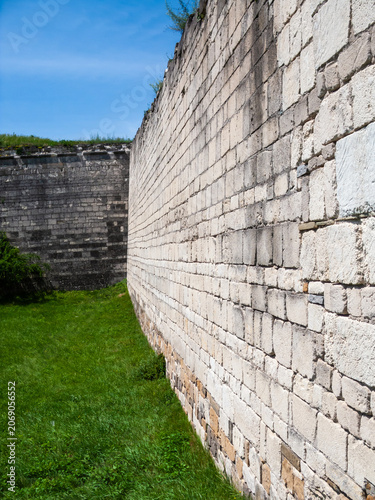 Exploring the stone walls of the historic Khotyn fortress in Khotyn, Ukraine on a sunny day
