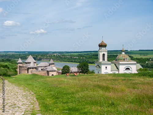 Khotyn fortress and church in Khotyn Ukraine beside the Dniester River on a clear day