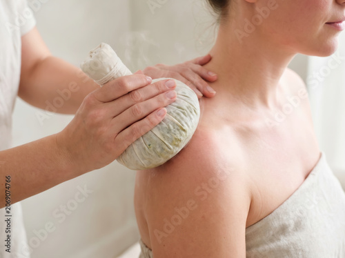Relaxing Herbal Compress Massage Spa Setting