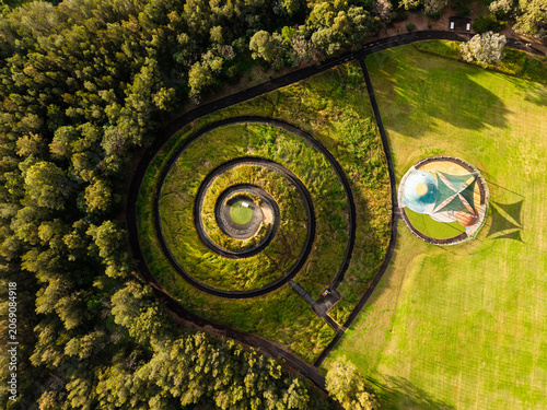 фотографія Aerial view of spiral green hill top.