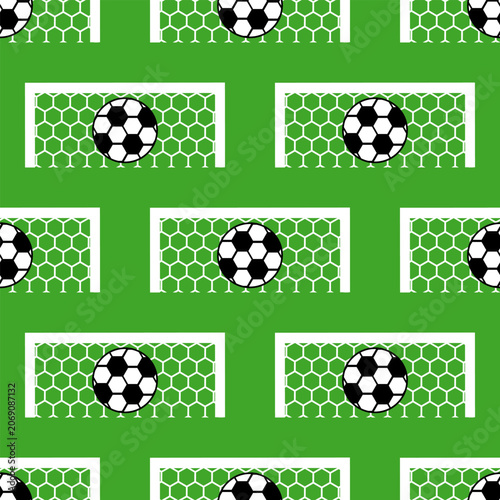 Seamless pattern with soccer balls in goal nets on green background.
