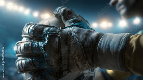 Soccer Goalkeeper Glove Holding Ball in Stadium Close Up