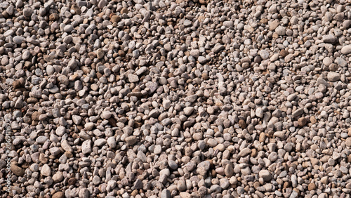 Canvastavla A close up view of small rounded pebbles covering the ground, creating a natural