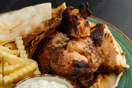 Charred Roasted Chicken With Pita, Crispy Fries And Garlic Dip, Warm Herb Aroma, Familystyle Plating, Cozy Kitchen Mood