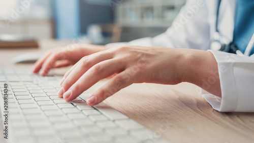 Healthcare professional working on computer