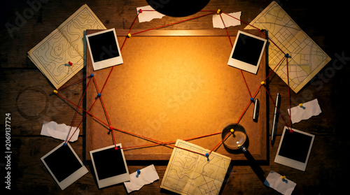 Crime scene investigation with evidence board and polaroid photos on wooden table