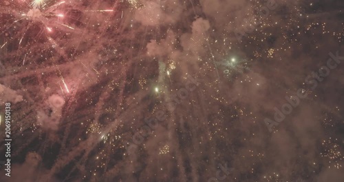 Golden fireworks exploding in night sky during celebration