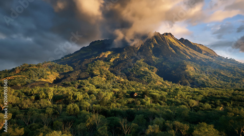 Breathtaking mountain scenery during sunset featuring vibrant greenery and stunning cloud formations