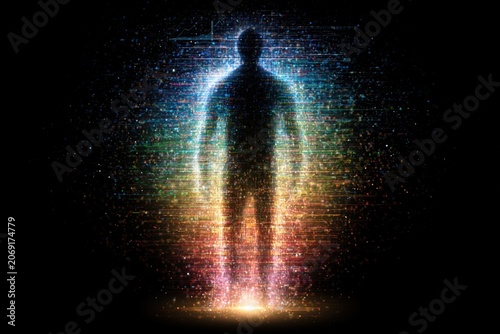 Silhouette of a glowing human figure made of colorful particles and digital data streams on black background