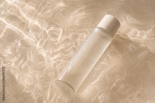 Minimal Cosmetic Bottle On Water Reflection Background