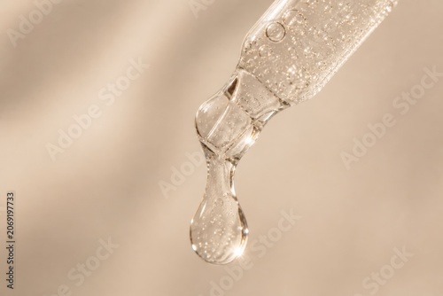 Transparent Cosmetic Gel Pouring In Soft Natural Light