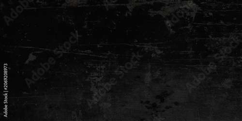 Φωτογραφία Dark grungy black background with scratched and distressed texture or black old wall cracked concrete background or black vintage seamless old concrete floor grunge background