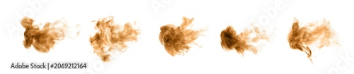 Foto Golden and brown sand dust like smoke swirling in a bomb storm, spraying in the air as colorful lumps on a black and white background