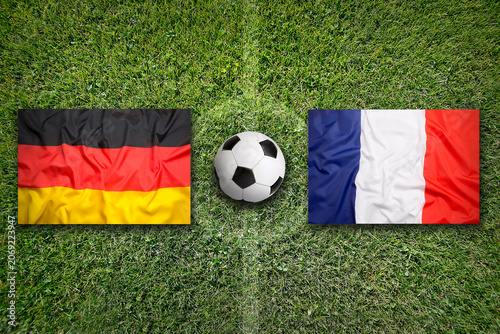 Germany vs. France flags on soccer field