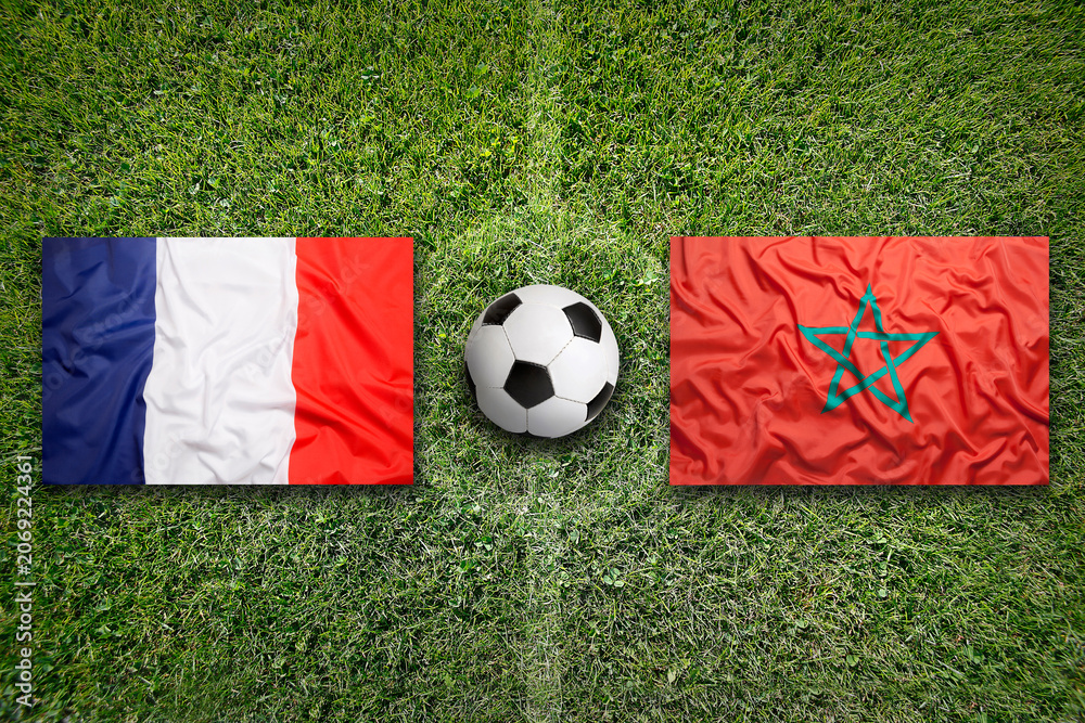 Obraz premium France vs. Morocco flags on a soccer field