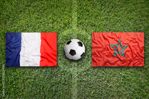 France vs. Morocco flags on a soccer field