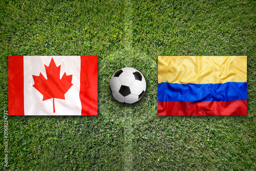 Canada vs. Colombia flags on a soccer field