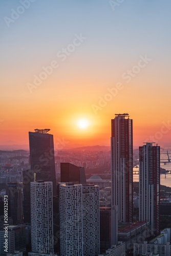 Golden sunset over the financial district of Yeouido with modern corporate skyscrapers in Seoul, South Korea