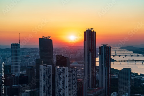 Golden sunset over the financial district of Yeouido with modern corporate skyscrapers in Seoul, South Korea