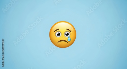 Sad emoji face with a tear on a blue background.