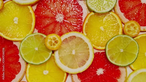 Top view of vibrant sliced mixed citrus fruits, showing colorful medley perfect for healthy eating and dietary concepts, inviting freshness and vitality