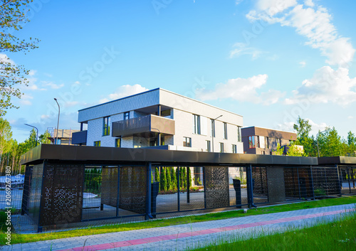Fotografie Modern contemporary apartment building with secure gated under croft parking