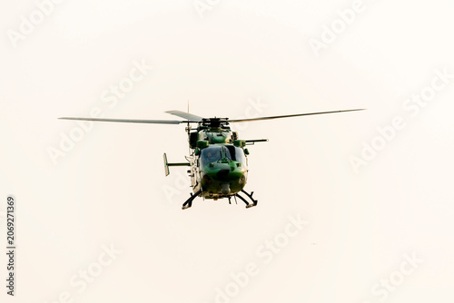 Helicopter is flying on isolated white background