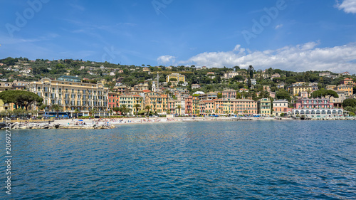 Scenic panoramic view of the colorful waterfront buildings and beach from the sea, Santa Margherita Ligure, Italy