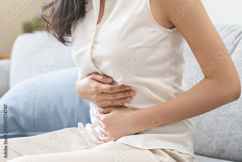 Flatulence ulcer, asian young woman, girl hands in belly, stomach pain from food poisoning, abdominal pain and digestive problem, gastritis or diarrhea. Abdomen inflammation, menstrual period people.
