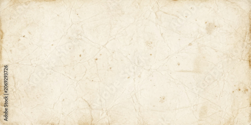 Speckled aged paper texture background in light beige with foxing for vintage scrapbook stationery and craft design