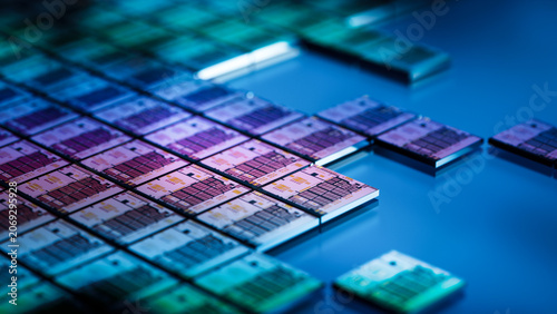 3D Render: Close-up of Silicon Dies with Integrated Circuits for Microchips during Extraction from a Semiconductor Wafer. Computer Chip Fabrication and Packaging Process.
