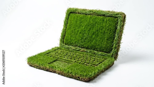 Conceptual green grass laptop computer on plain white background.