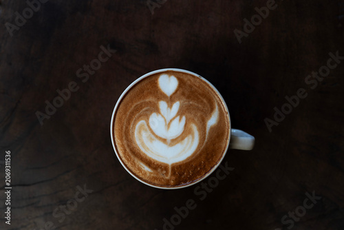 cappuccino on dark old grunge wooden table top view