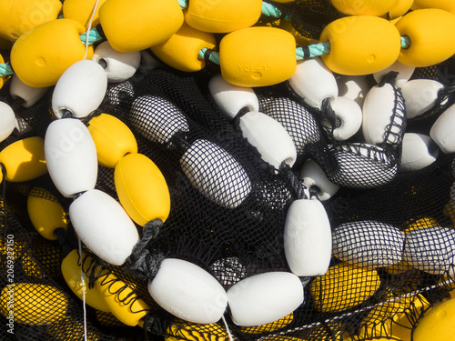 Canvas Print Fishing buoys in a net at a Colindres, Cantabria, Spain
