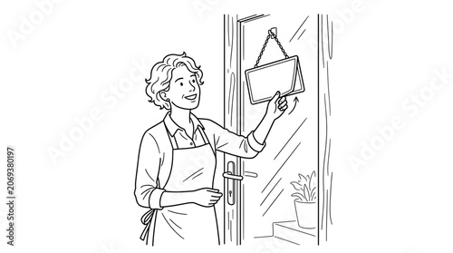 A smiling woman in an apron flipping an open sign on a shop door