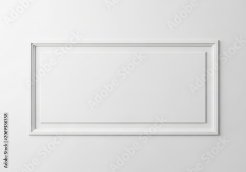 A white picture frame on a wall with no image