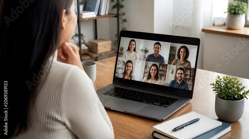 Woman Connects with Diverse Colleagues on Video Call for Remote Collaboration