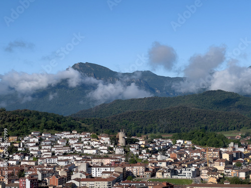 Olot town cityscape under Pyrenees mountains in Catalonia