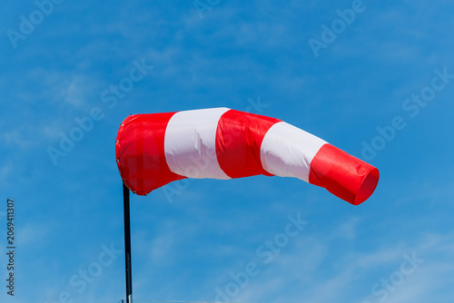 Windsock Blowing in the Wind Against Blue Sky