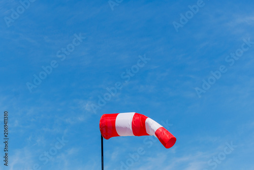 Windsock Blowing in the Wind Against Blue Sky