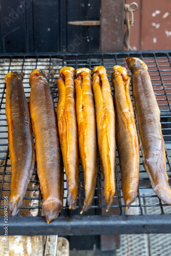 smoked eels on a grille