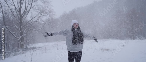 Happy Latina Woman from Colombia Enjoying Snow in Germany During Winter