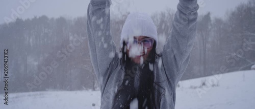 Happy Latina Woman from Colombia Enjoying Snow in Germany During Winter
