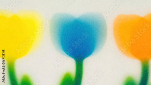 Colorful tulips in yellow, blue, and orange against a soft background during springtime